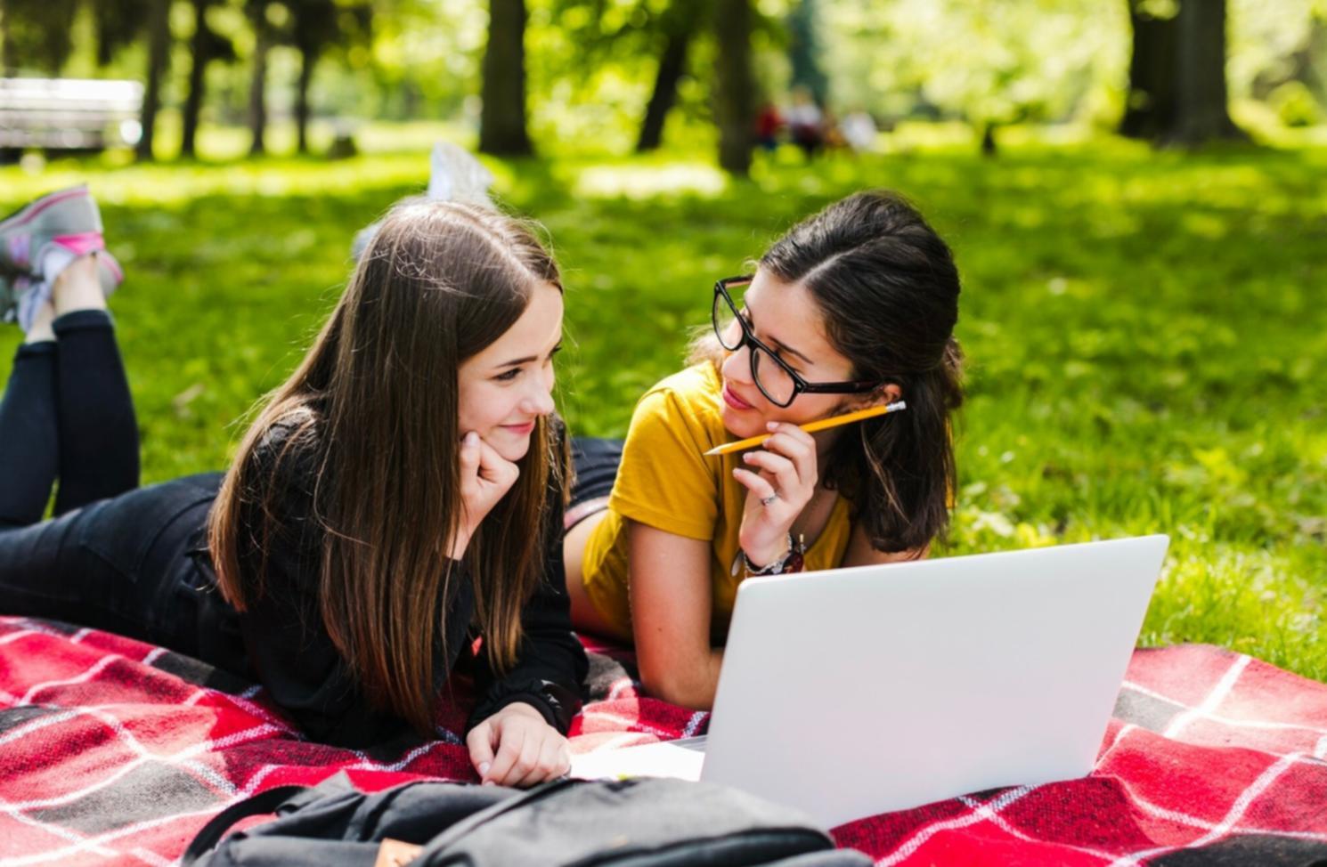 Students learning digital budgeting techniques on mobile devices